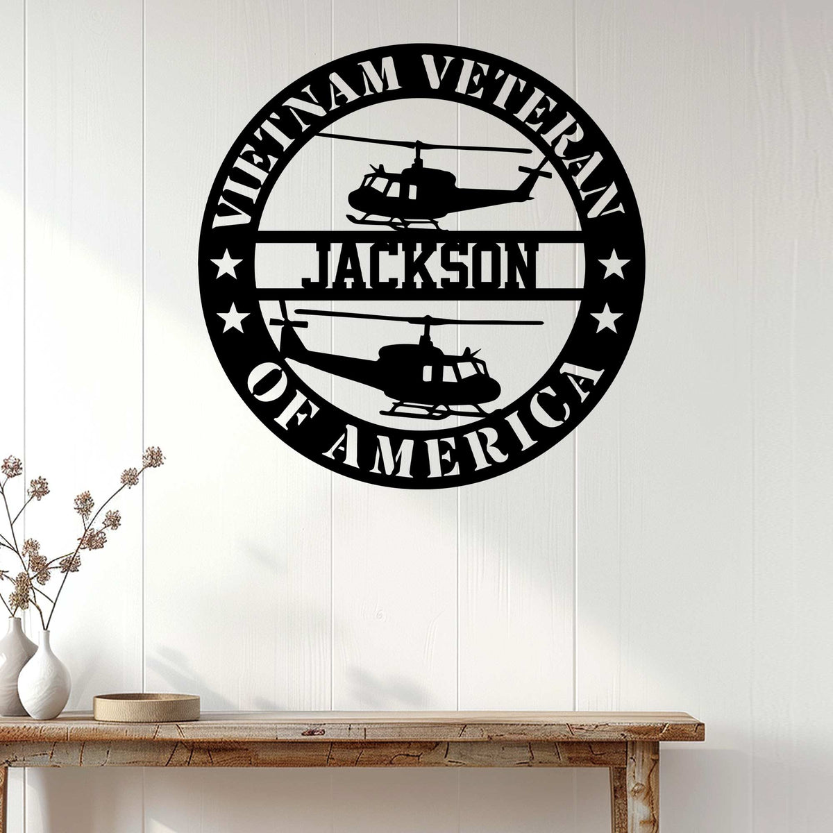 Vietnam Veteran wall sign displayed on a light wood-paneled wall above a console table