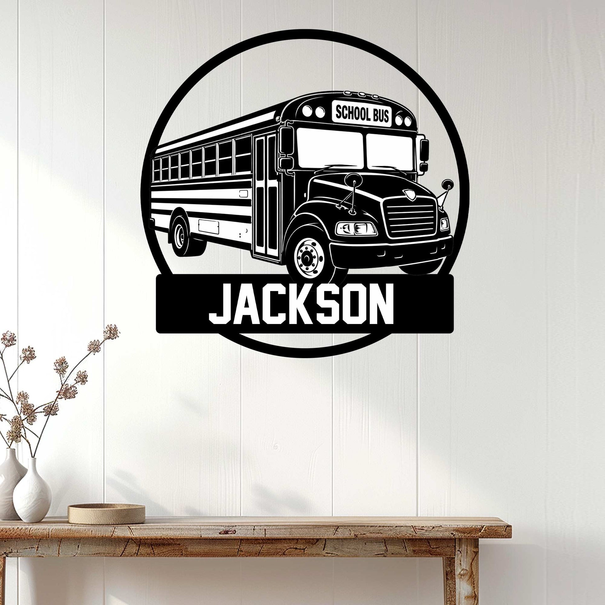 School bus metal wall sign displayed on a light wood-paneled wall in a home interior