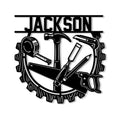 Carpenter metal sign featuring a circular saw blade frame with a hammer, hand saw, tape measure, chisel, and pencil