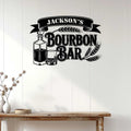 Bourbon bar metal sign displayed as home bar wall decor above a wood console table