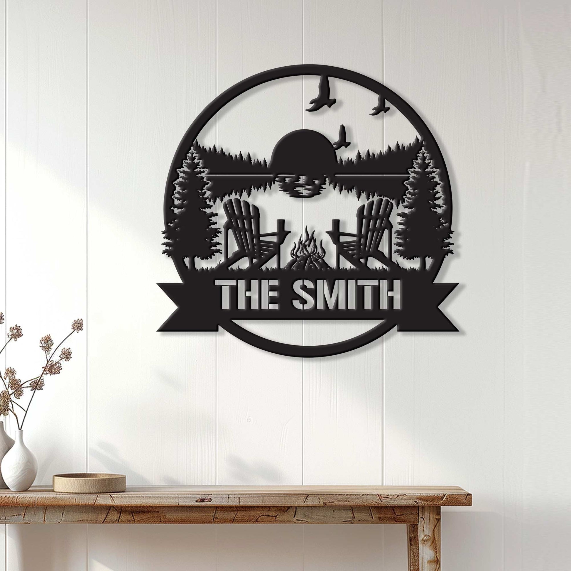 Lake house metal wall sign displayed on a white-paneled wall above a rustic console table