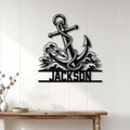 Anchor metal sign displayed on a white paneled wall above a wooden console table
