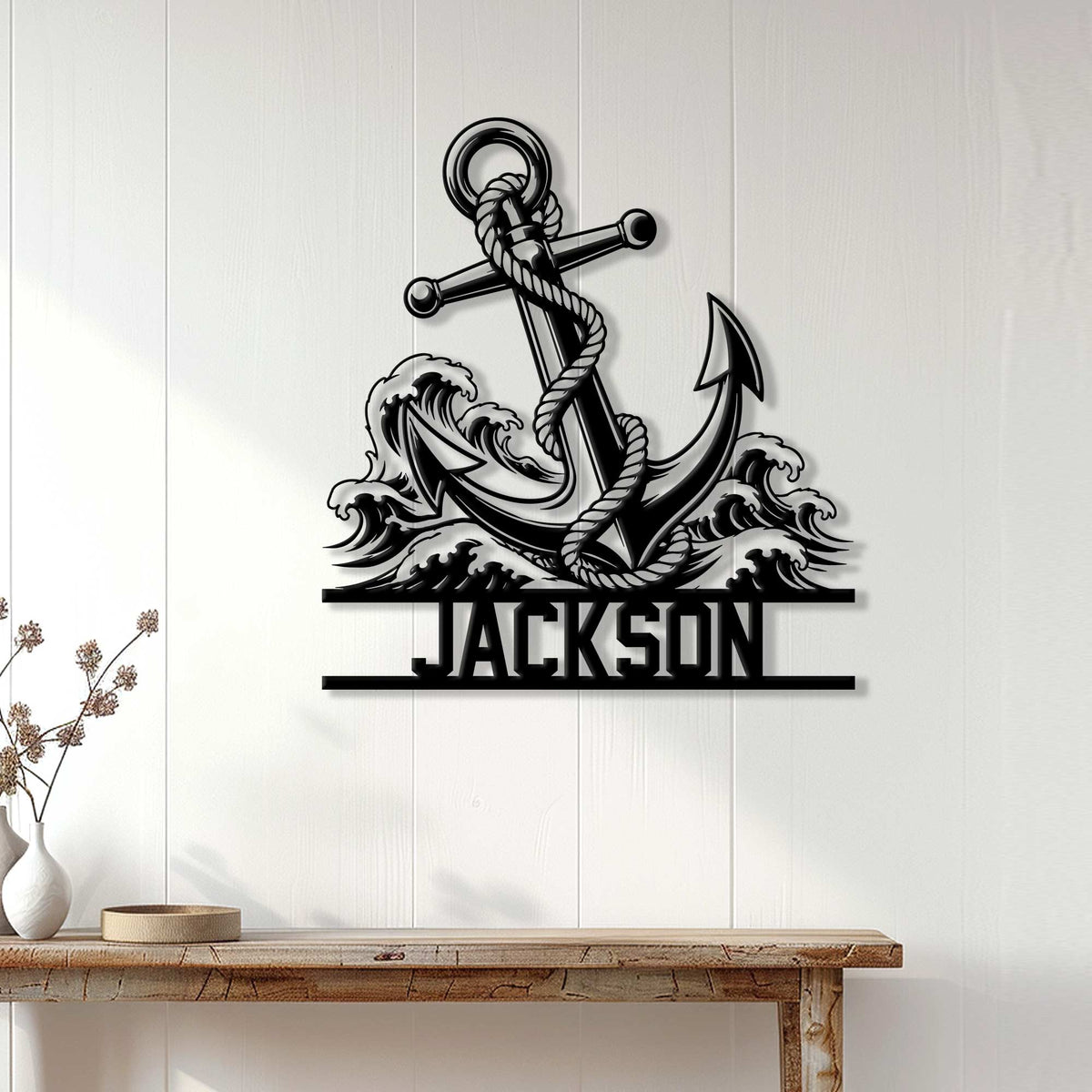 Anchor metal sign displayed on a white paneled wall above a wooden console table