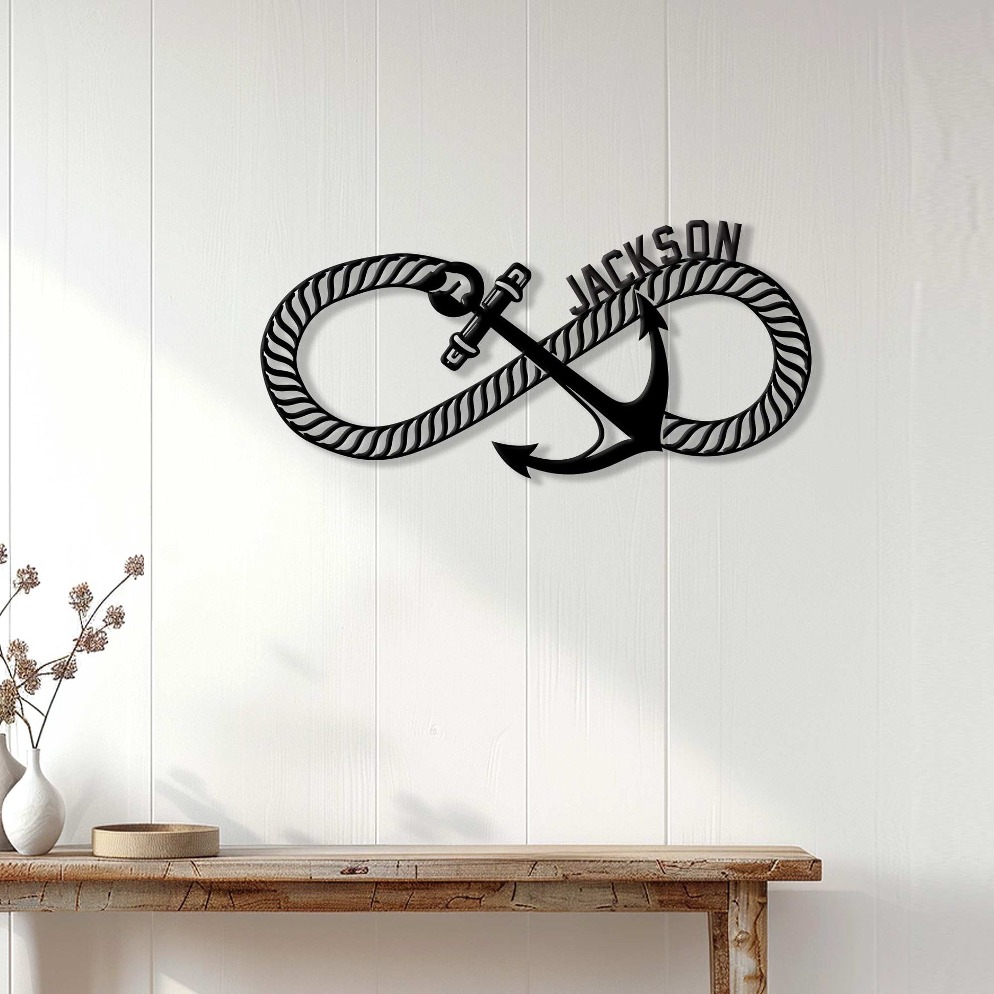 Nautical anchor wall decor displayed on a light wood-paneled wall above a console table