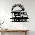 Taco food truck wall sign displayed on a light wood-paneled wall above a rustic console table