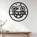 Cyclist wall sign displayed on white paneling above a console table in a bright home interior