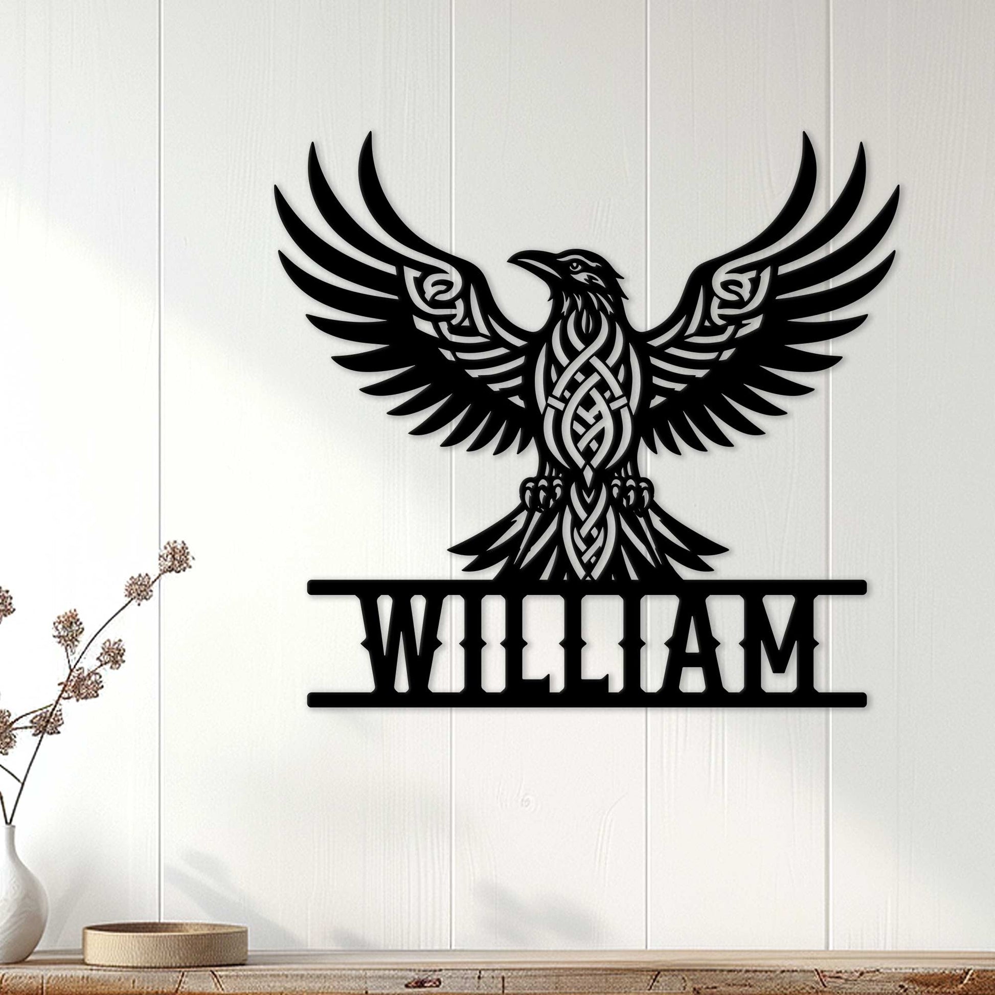 Custom Norse raven wall sign displayed on a light wood-paneled wall in a home decor setting