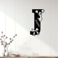 Cheerleader metal wall sign displayed on white paneled decor with a jumping silhouette and decorative bow