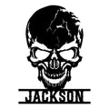Bold black skull metal sign with a dramatic cracked skull design and custom lower name detail