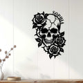 Rose-adorned skull wall sign displayed on a light paneled wall in a modern home setting