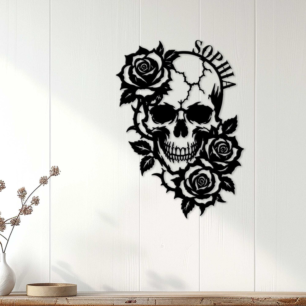 Rose-adorned skull wall sign displayed on a light paneled wall in a modern home setting