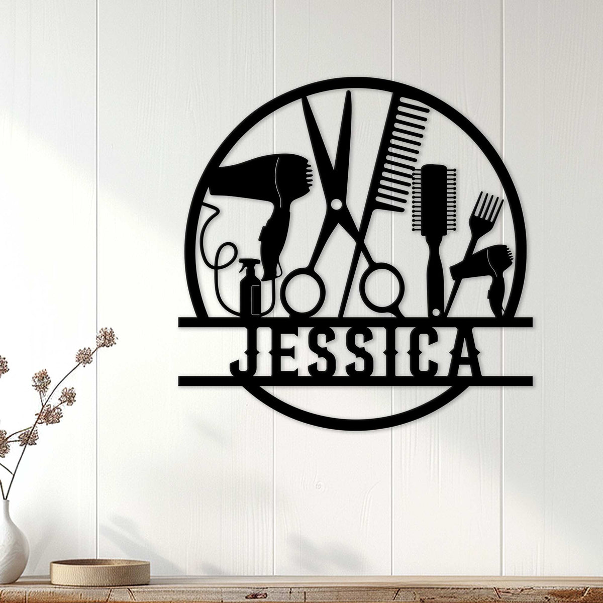 Black hairstylist metal wall sign displayed on a white paneled wall in a salon-inspired space