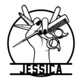 Hairstylist metal sign featuring a hand holding scissors, comb, razor, and styling tools