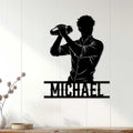 Black bartender silhouette wall sign displayed against a light wood-paneled interior