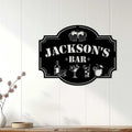 Bartender metal sign displayed on a light wood wall, creating a stylish home bar accent