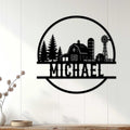 Black farm wall decor displayed on a white paneled wall above a wooden console