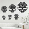 Tree of Life metal sign shown in multiple size options above a modern living room sofa