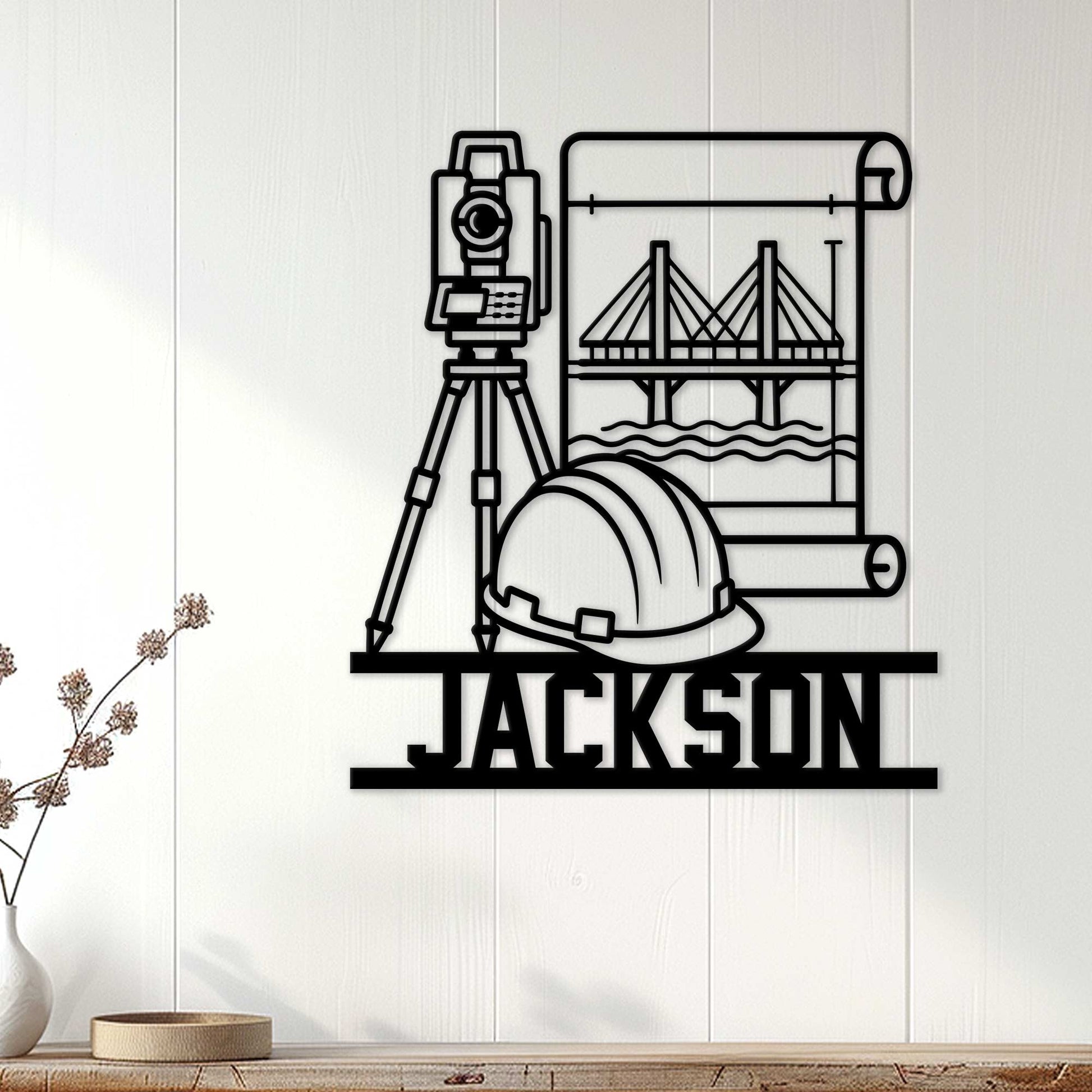 Civil engineer wall decor displayed on a light wood wall with a surveyor tool, hard hat, bridge, and blueprints