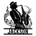 Black metal sign featuring a jazz saxophone player silhouette surrounded by musical notes and staff lines
