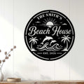 Round beach house wall sign displayed on white coastal paneling above a console table