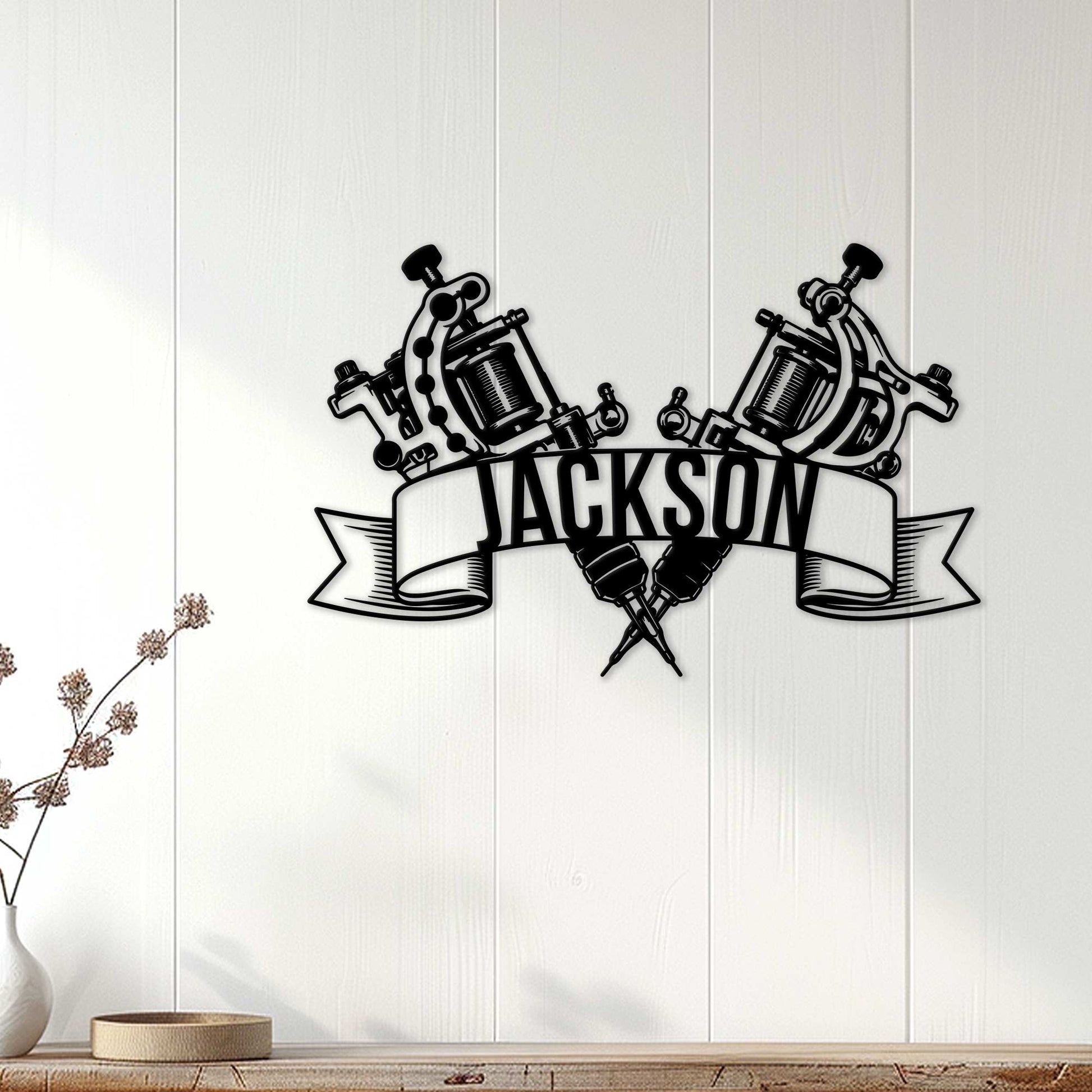 Tattoo artist metal sign displayed on a light wood wall as creative tattoo studio decor