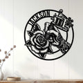 Tattoo studio wall decor displayed on white paneling, featuring a hand, tattoo machine, and detailed rose