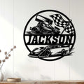 Black and white custom racing sign displayed on a white paneled wall as motorsport-inspired decor