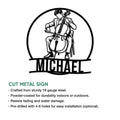 Cut metal cello sign featuring a seated cellist design with indoor and outdoor display details