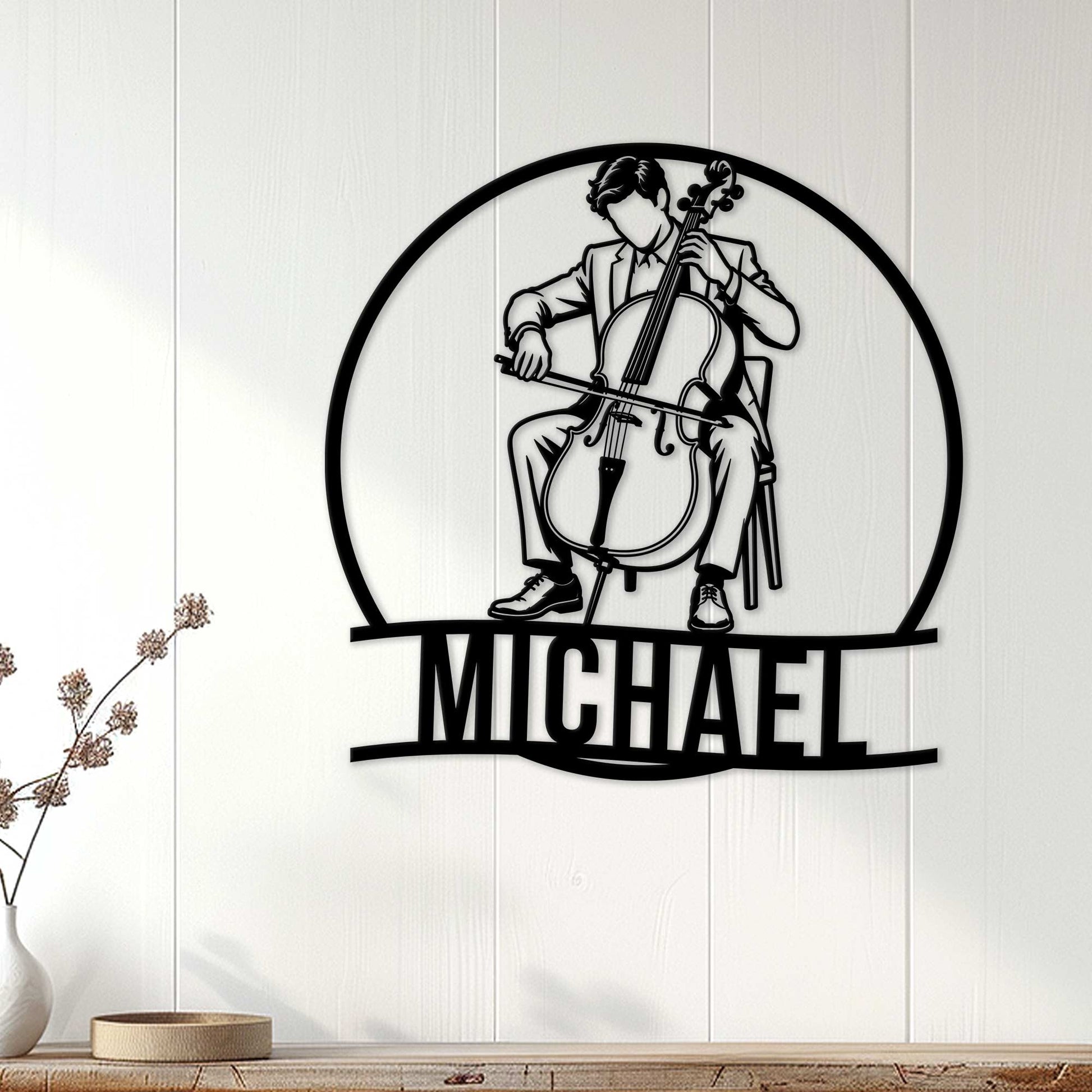 Cello player metal wall sign displayed on a light wood-paneled wall in a modern home