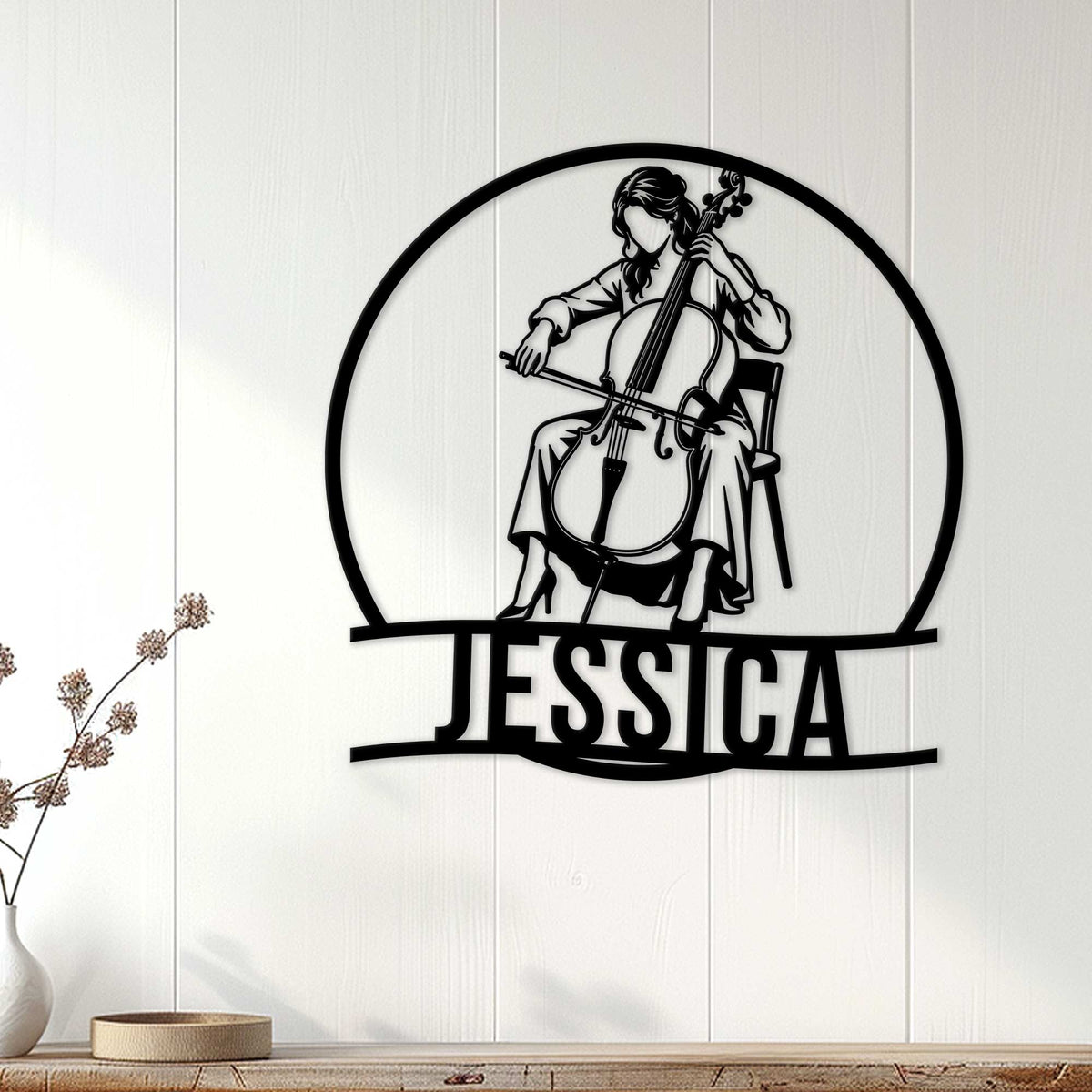 Cellist metal wall sign displayed on white paneling above a console table