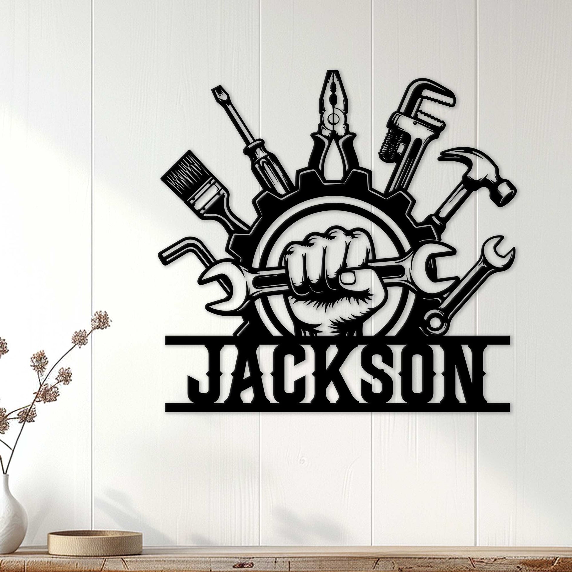 Mechanic wall sign displayed on white paneling, featuring a gear, tools, wrench, hammer, and bold industrial artwork