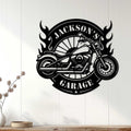 Black motorcycle wall sign displayed on white paneling as bold garage decor for a biker space