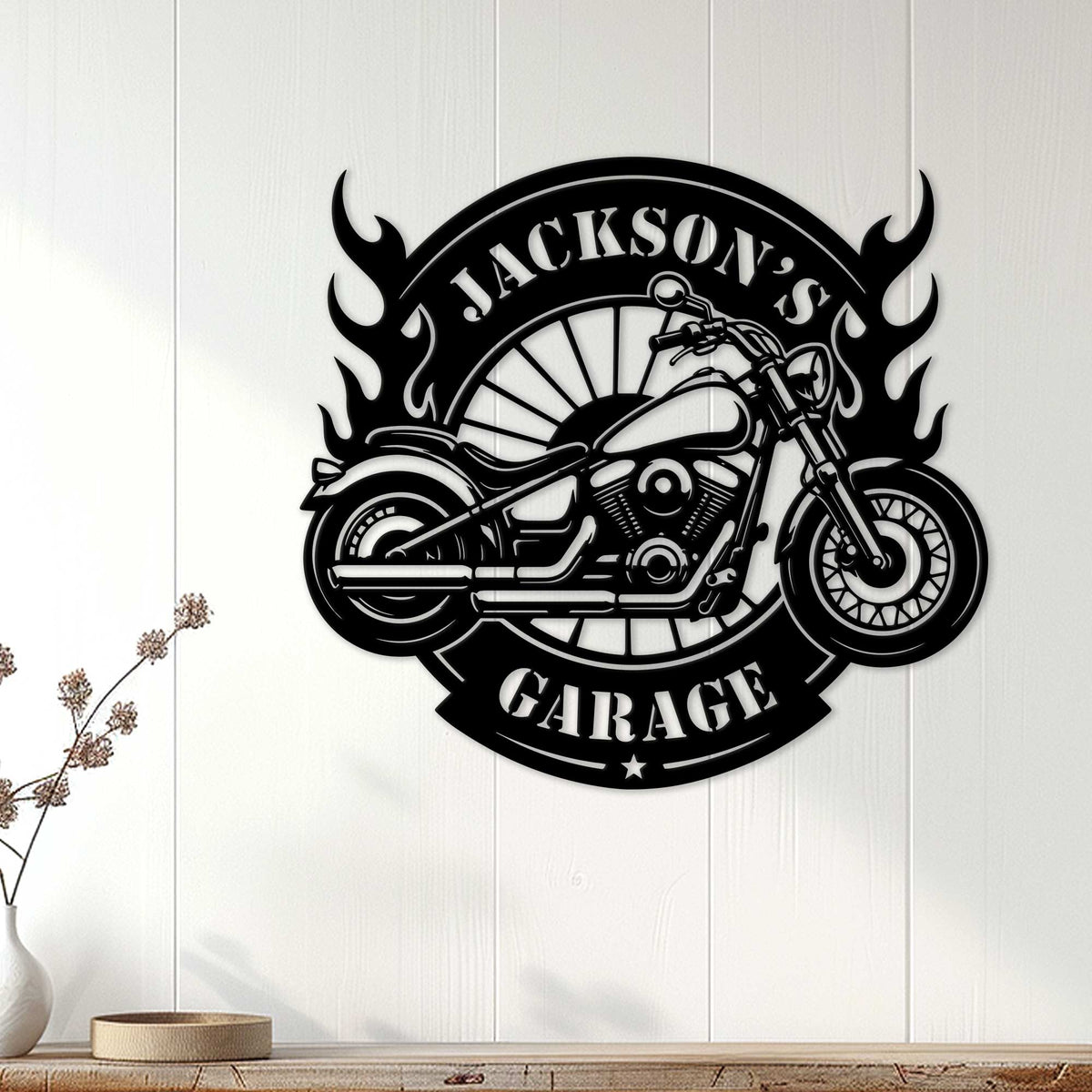 Black motorcycle wall sign displayed on white paneling as bold garage decor for a biker space