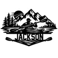 Kayak metal sign featuring a paddler on a mountain lake with pine trees and bold silhouette artwork