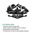 Kayak wall sign artwork with a paddler, mountain landscape, lake scene, and cut metal sign feature details