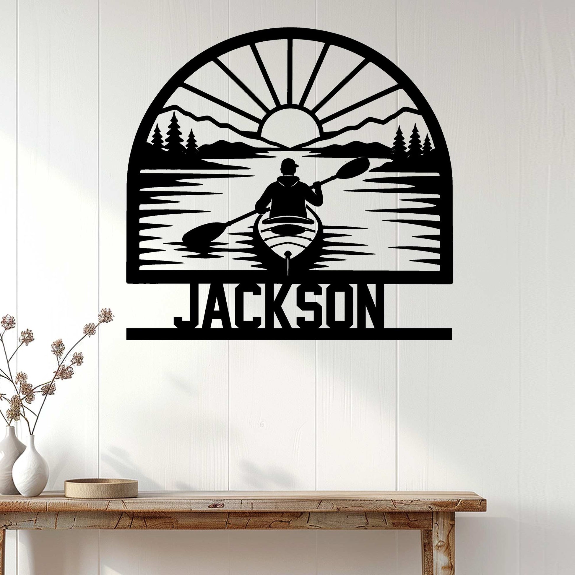 Kayak wall decor displayed on a white paneled wall above a rustic console table