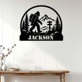 Bigfoot metal wall sign displayed on white wood paneling above a rustic console table