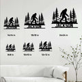 Bigfoot metal sign size guide showing multiple sign sizes displayed on a living room wall