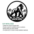 Cut metal gorilla sign shown with a mountain forest design and circular silhouette artwork