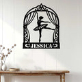 Ballerina metal wall decor displayed on a light wood-paneled wall above a console table
