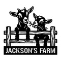 Black goat metal sign featuring an adult goat and kid peeking over a rustic farm fence