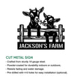 Cut metal goat farm sign showing two goats over a wooden fence with a bold farm design