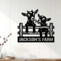 Goat farm metal wall sign displayed on a light wood-paneled wall in a farmhouse setting