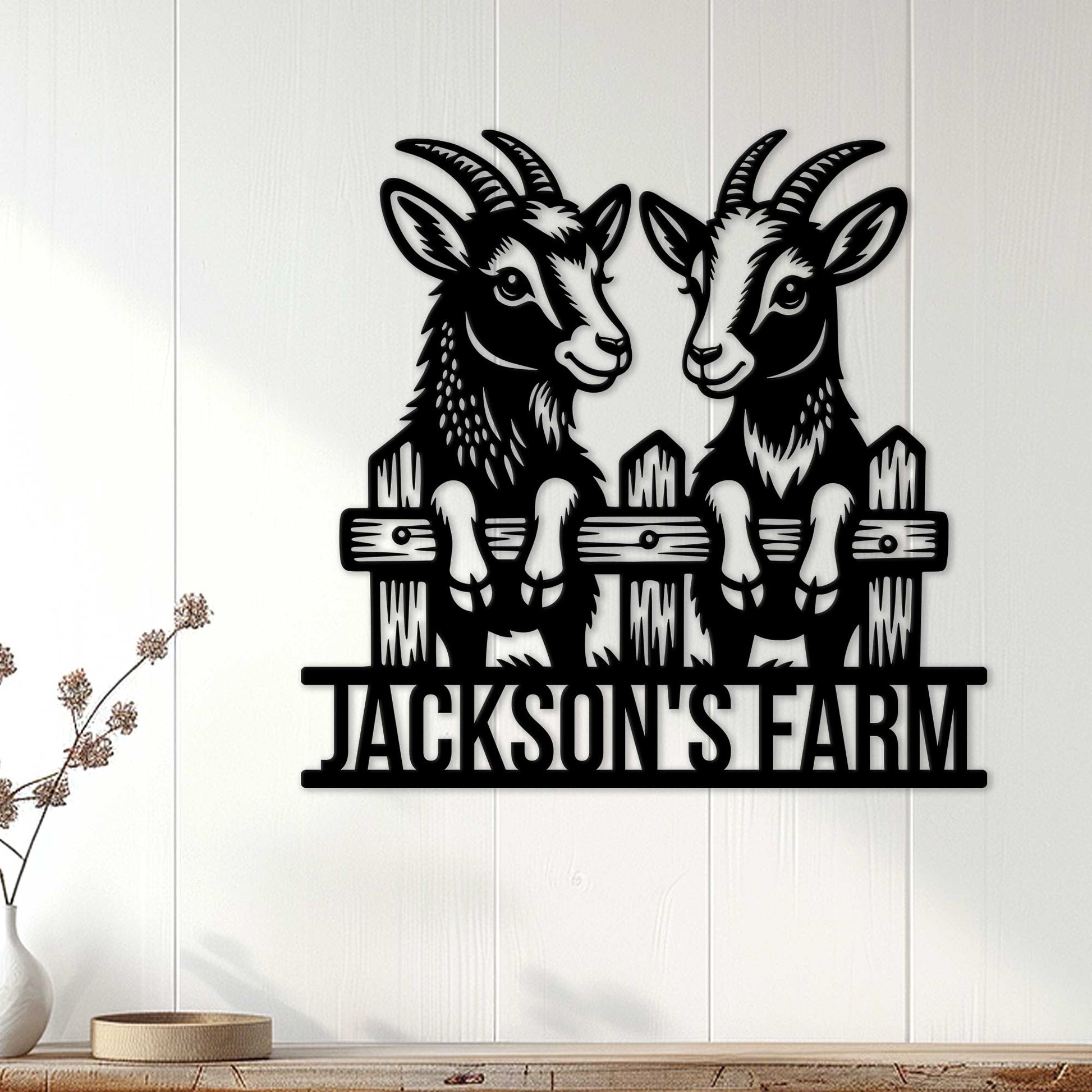 Black goat wall sign displayed on white wood paneling in a farmhouse-style room
