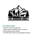 Cut metal trekking sign featuring a family hiking through mountain scenery with pine trees and a dog