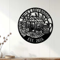 Black greenhouse garden sign displayed as wall decor above a console in a bright home