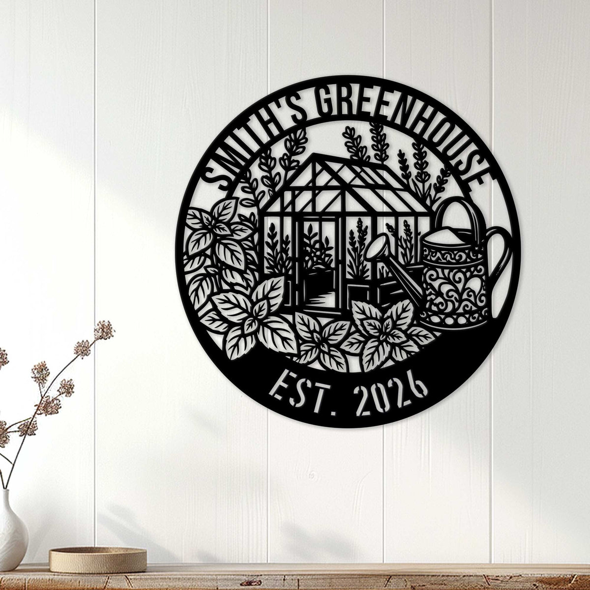 Black greenhouse garden sign displayed as wall decor above a console in a bright home