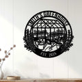 Black greenhouse garden metal sign displayed on a white paneled wall as indoor gardener decor
