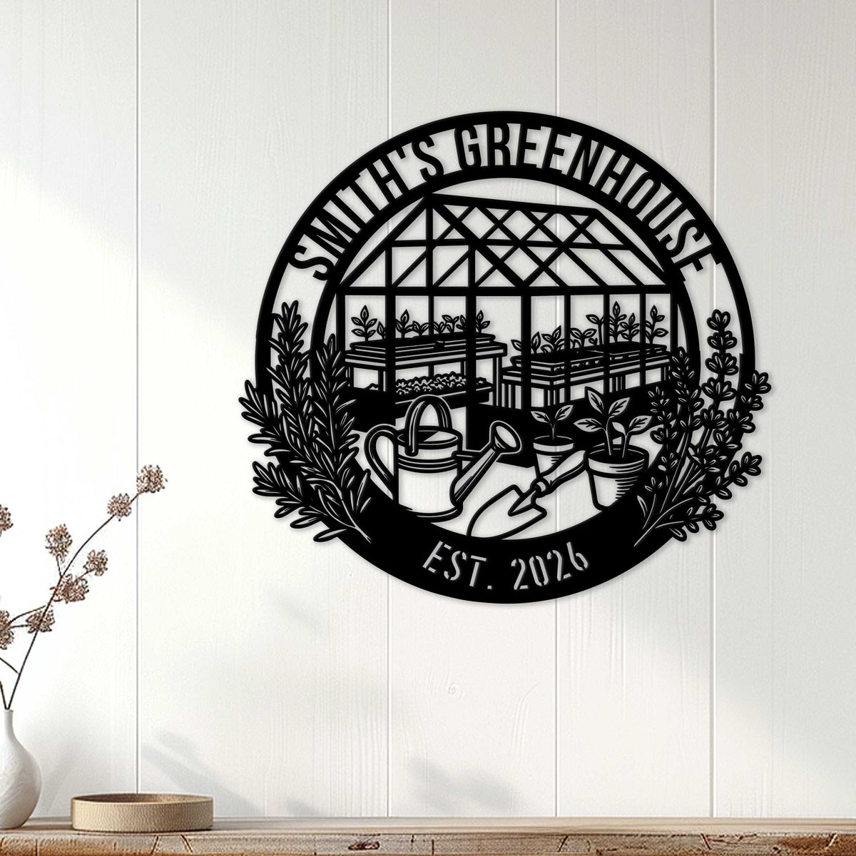 Black greenhouse garden metal sign displayed on a white paneled wall as indoor gardener decor