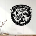 Tattoo studio wall decor displayed on a white paneled wall with a rose and tattoo machine design